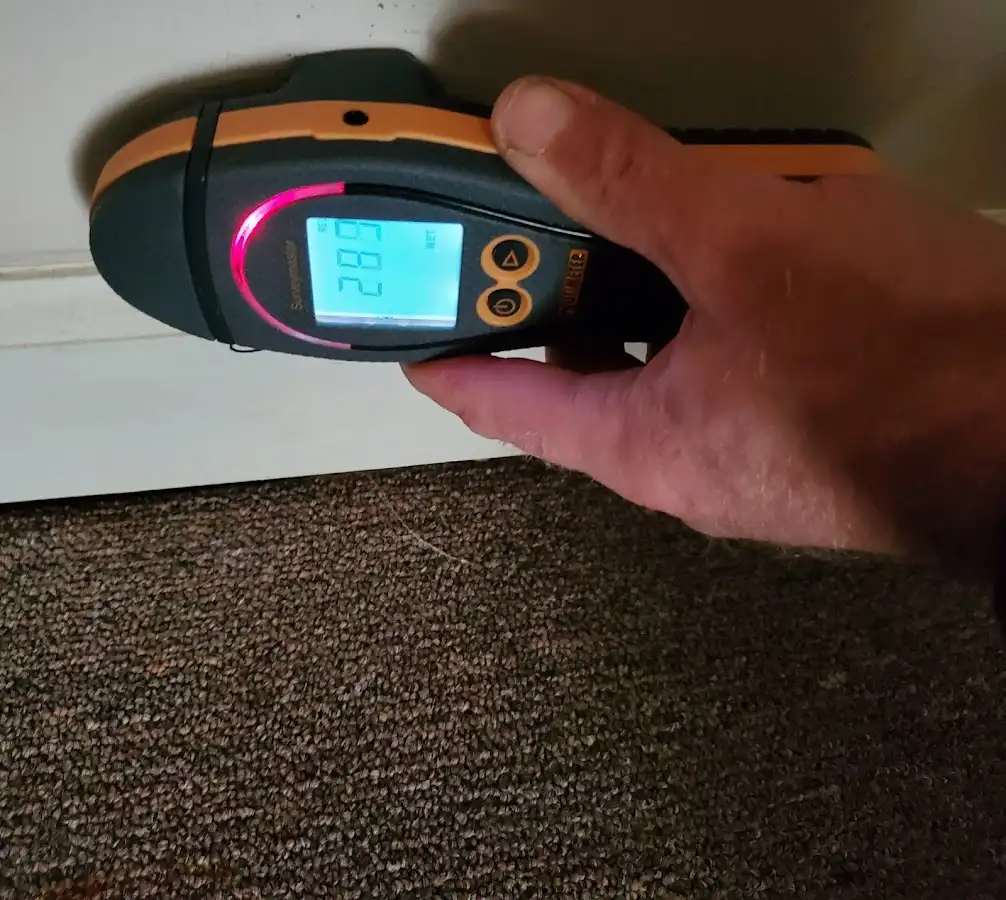 Moisture detection at baseboard during Storm Damage Restoration in Billerica